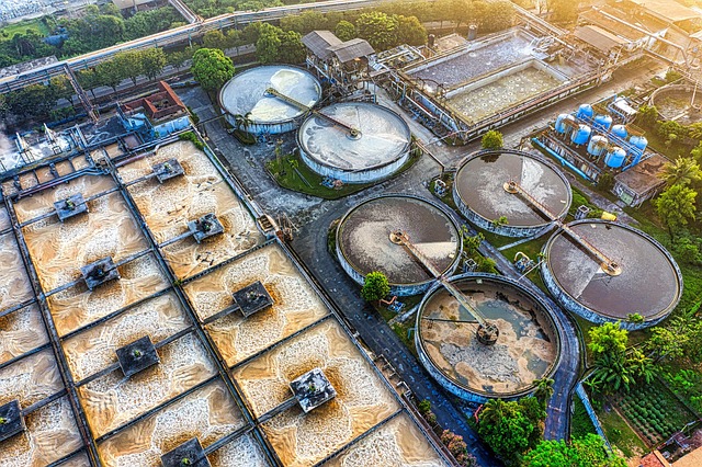 Aerial view of a large wastewater treatment facility with aeration tanks