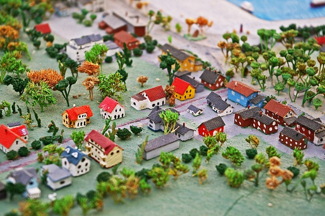 A miniature model town with small toy houses and trees