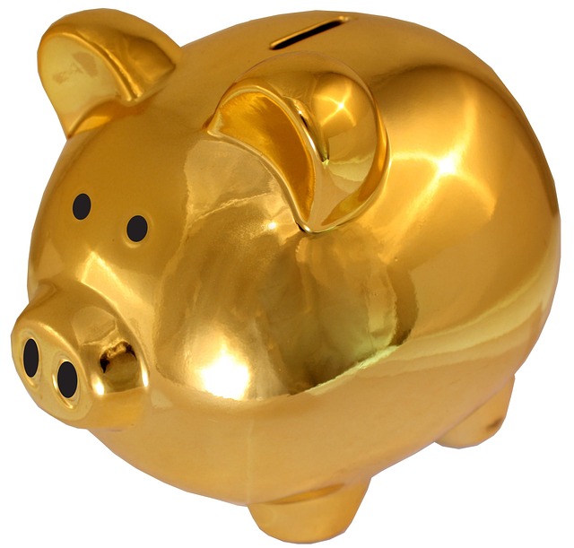 A shiny golden piggy bank on a white background