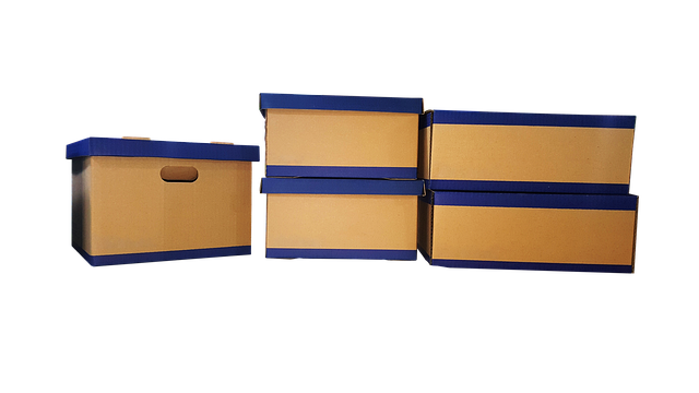 Several cardboard storage boxes with blue lids stacked together