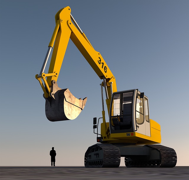 A large yellow excavator next to a small person silhouette