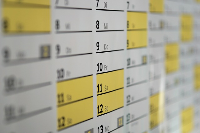 A close-up view of a calendar planner with highlighted days