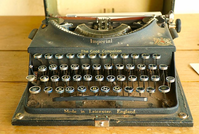 A vintage typewriter on a wooden desk